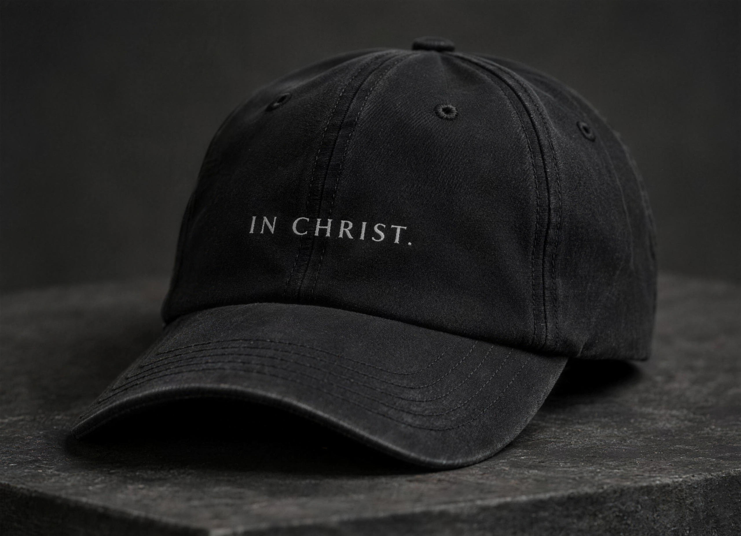 Essential Cap, side, on a stone surface