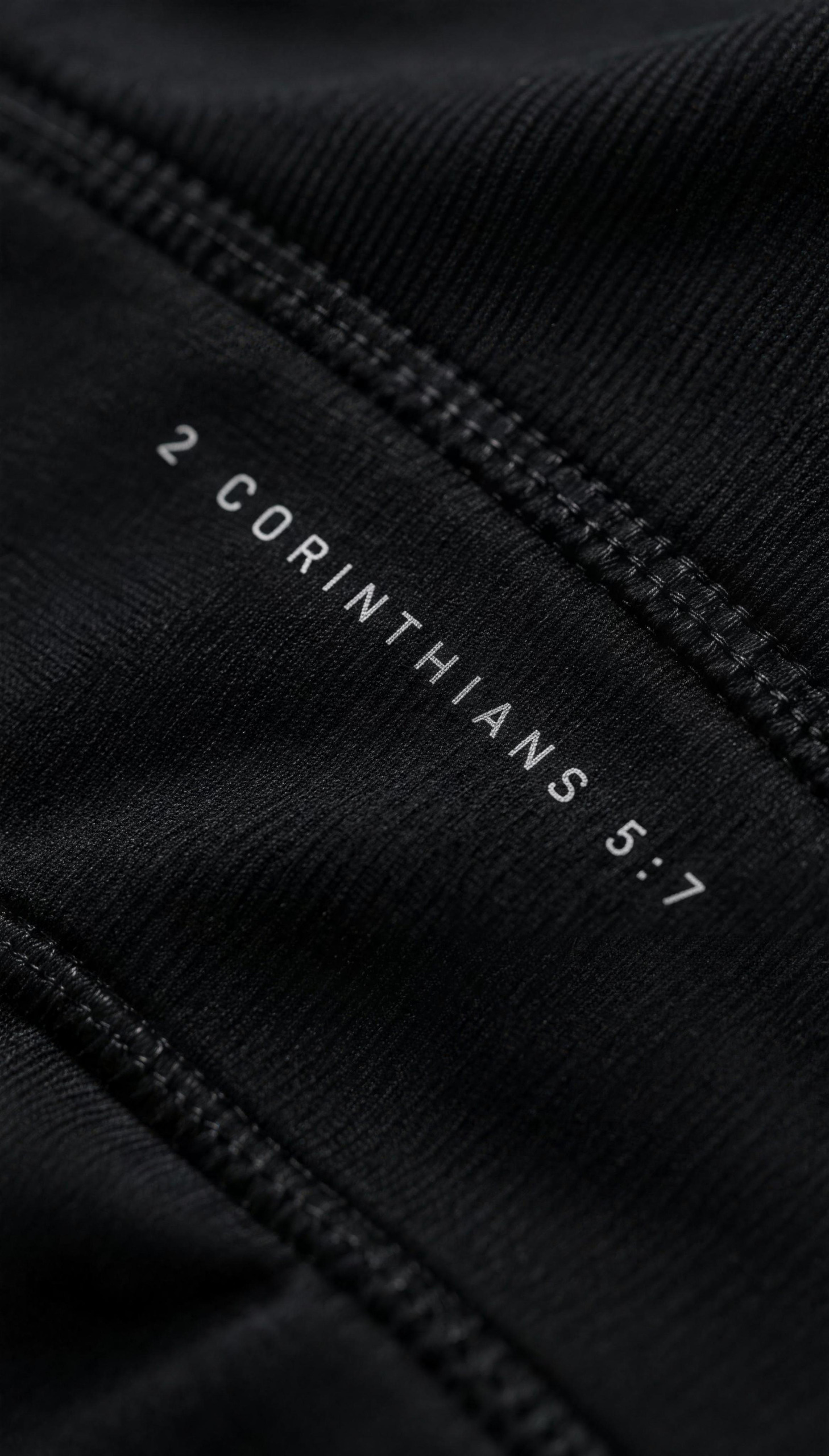 Close detail of the scripture reference along the seam